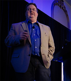 Kevin Mullett Speaking from Stage in NYC